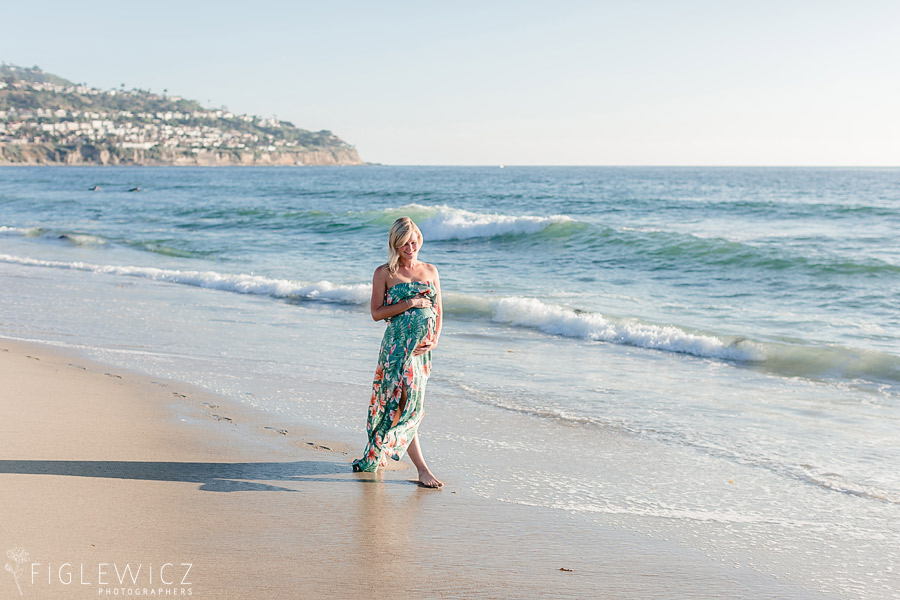 mother walking along beach with palos verdes in background