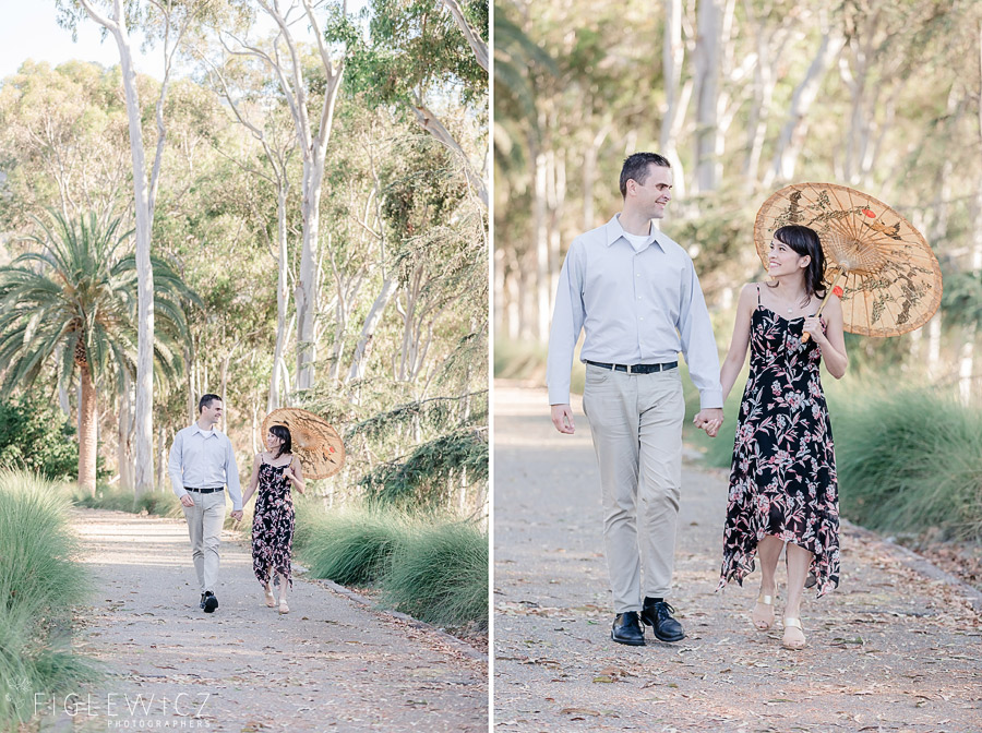 engaged couple strolling through palos verdes with parasol